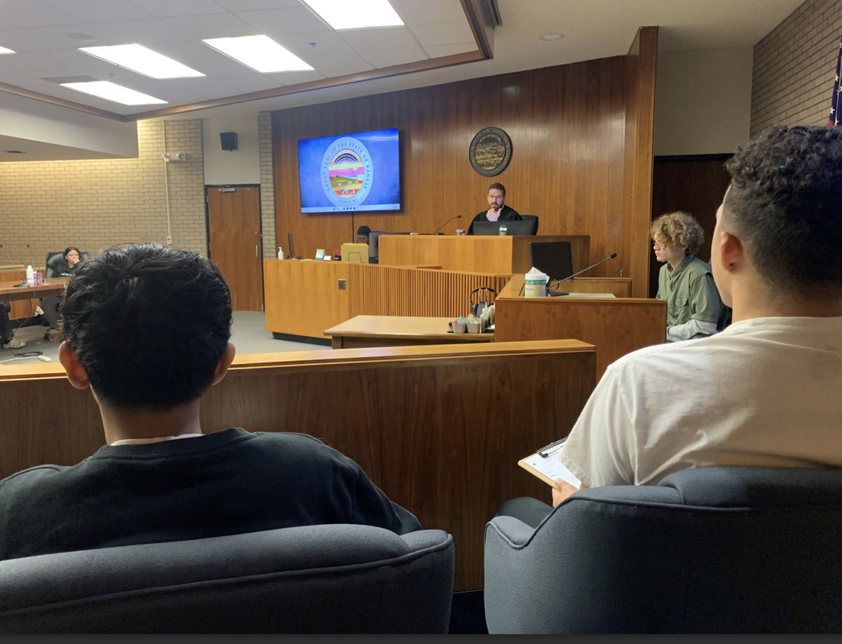 Sophomore Karan Vashisth and freshman Kytrell Johnson take notes on the case being presented at the 28th Judicial District Court on Nov. 6 as part of a mock trial.